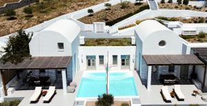 an aerial view of a villa with a swimming pool at Thimari Lodge in Fira
