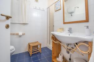a bathroom with a sink and a toilet at La collina sui trabocchi in Ortona