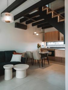 a living room with a couch and a table at Palmera in Władysławowo