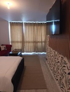 a hotel room with a bed and a couch at Vannes in Brest