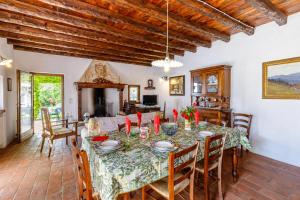 a dining room with a table and chairs at Villa Formaga Stunning View & Garden - Happy Rentals in Gargnano