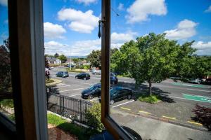 a view from a window of a parking lot at Spacious 1 Bed apartment City centre in Palmerston North