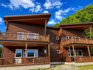 a house with balconies on the side of it at Olavsberget camping in Porsgrunn +7 photos