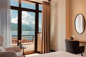 a hotel room with a view of the water at Hotel Aleksandrija in Ohrid