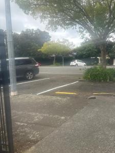 a van is parked in a parking lot at Spacious 1 Bed apartment City centre in Palmerston North +4 photos