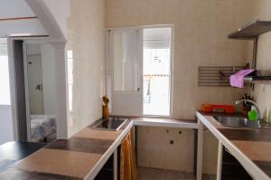 a kitchen with a sink and a counter top at Hospedaje Lisboa Algeciras P Ca 0214 y A Ca 0232 in Algeciras +165 photos