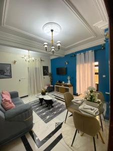 a living room with a couch and a table at Lita Residence in Yaoundé