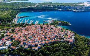 an aerial view of a small island in a body of water at Room Marta in Omišalj +14 photos