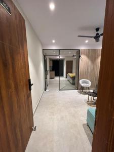 a hallway with a door leading to a bedroom at Cloud Eleven House in Kharar