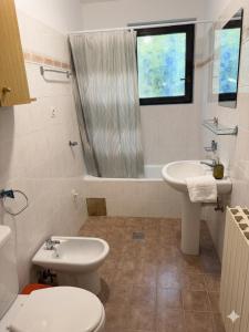a bathroom with a toilet and a sink at Danilo Room in Pula