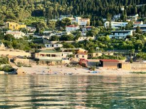 a view of a beach from the water at Gezim guest house in Shirokë