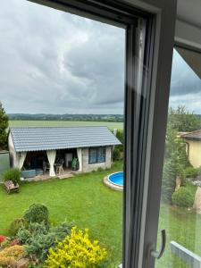 a view from a window of a yard at U zlatého křížku in Loukov