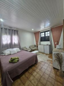 a bedroom with a large bed in a room at Le Cuprum in Le Robert