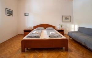 a bedroom with a bed and a couch at Danilo Room in Pula +9 photos