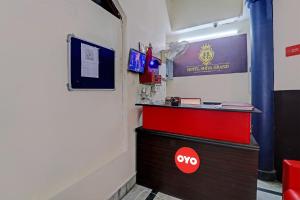 a room with a desk and a red drawer at Hotel O Shiva Grand in Chinhat +21 photos