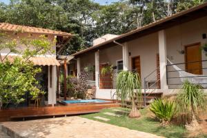 a house with a garden in front of it at Sattva Pousada in Pirenópolis