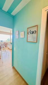a blue wall in a room with a dining room at Ticino Lakeview Apartment in Bissone