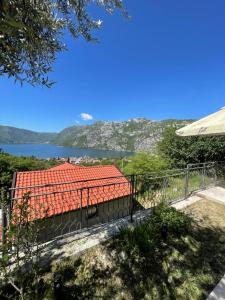 a view of a house with a red roof at Apartman Teodora in Risan