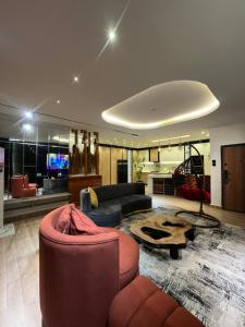 a living room with a couch and a table at Bgold home Apartment in Lekki