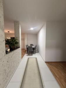 a dining room with a black table and chairs at DrimResidence in Struga +4 photos