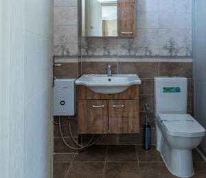 a bathroom with a sink and a toilet at Karacan Hotel - Dalaman Airport in Dalaman +60 photos