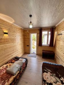 a large room with a bed and a window at Tamchy Residents in Tamchy