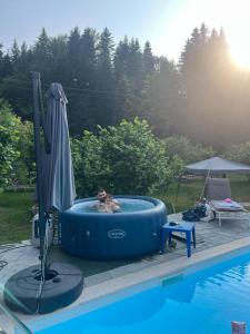 a person is in a blue inflatable at GOČ Planinska Kuća MILJA in Kraljevo