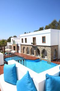 a villa with a swimming pool and a resort at saraya otel in Bodrum City