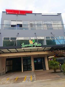 a building with a sign on the side of it at Hotel Laureles Park in Medellín
