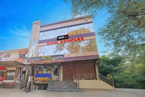 a building with a high company sign on it at Hotel O City View in Alīgarh +21 photos