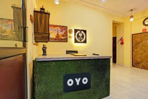 an office with an oro sign on a counter at Hotel O City View in Alīgarh