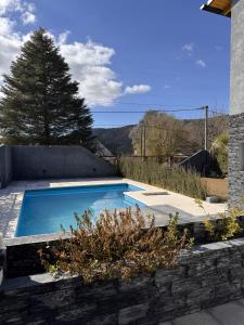 a swimming pool in the backyard of a house at Aurea san antonio in San Antonio de Arredondo