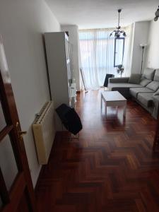 a living room with a couch and a table at Ciudad De Sada in Sada