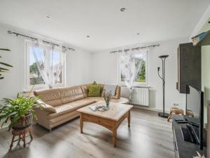 a living room with a couch and a coffee table at Frida in Lichtenhain