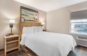 a bedroom with a white bed and a window at Extended Stay America Suites - Charleston - Mt Pleasant in Charleston +21 photos