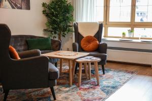 a living room with two chairs and a table at Ferienwohnung BGD in Berchtesgaden