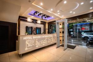 a hotel entrance with a hotel shilling institution at Hotel Shivdev International, near New Delhi Railway Station & City Centre in New Delhi