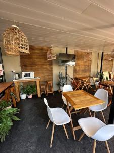 a dining room with a table and chairs at Los Lirios Apart & Suite in Puerto Iguazú