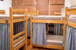 a group of bunk beds in a room at Rio Vibes Hostel - Hostel na Glória, AC, Social Vibe & Próximo a Lapa in Rio de Janeiro +63 photos
