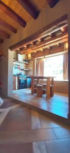 a dining room with a table and a window at Ocres de mi Tierra in Tilcara +44 photos