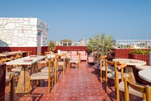 a row of tables and chairs on a patio at Casa Bamba in Veracruz