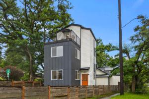 a tiny house on top of a wooden fence at Modern House in Seattle in Seattle