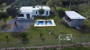 an aerial view of a house with a swimming pool at Quinta Bello Cielo in Montemorelos