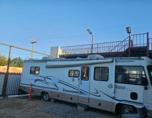 a white caravan parked in a parking lot at Casa Rodante Tony 1 in San Felipe