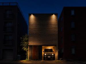a truck is parked in front of a building at Haus128 in Sapporo