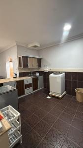an empty room with a kitchen with a counter top at الدانه1 in Al Wajh +1 photo