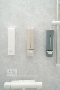 a wall with a bunch of products on it at AoAsoVilla in Aso