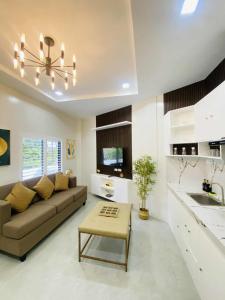 a living room with a couch and a table at Grospe Resort Boracay in Boracay