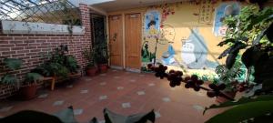 a courtyard with plants in front of a building at Colonia Real in Sucre +11 photos