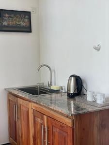 a kitchen with a sink and a counter top at Moon Mist Villa- Hatton in Hatton +16 photos